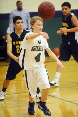 Greenhills sophomore Emmet Kulka passes the ball to a teammate during the first half at Greenhills on Thursday. Melanie Maxwell I AnnArbor.com